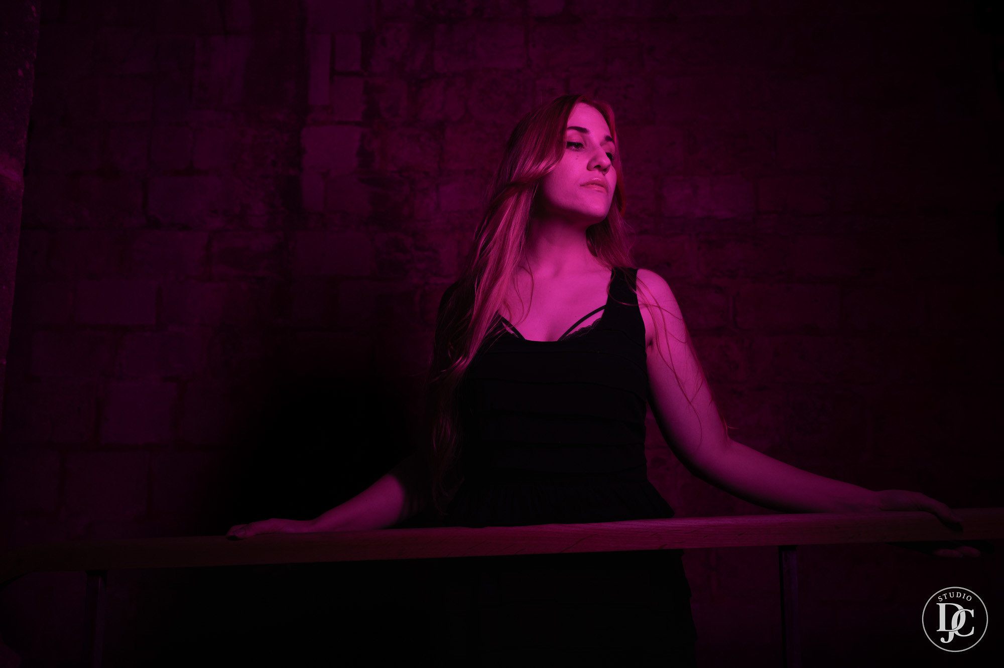 Poised between stone and silence, presence steady in the glow.